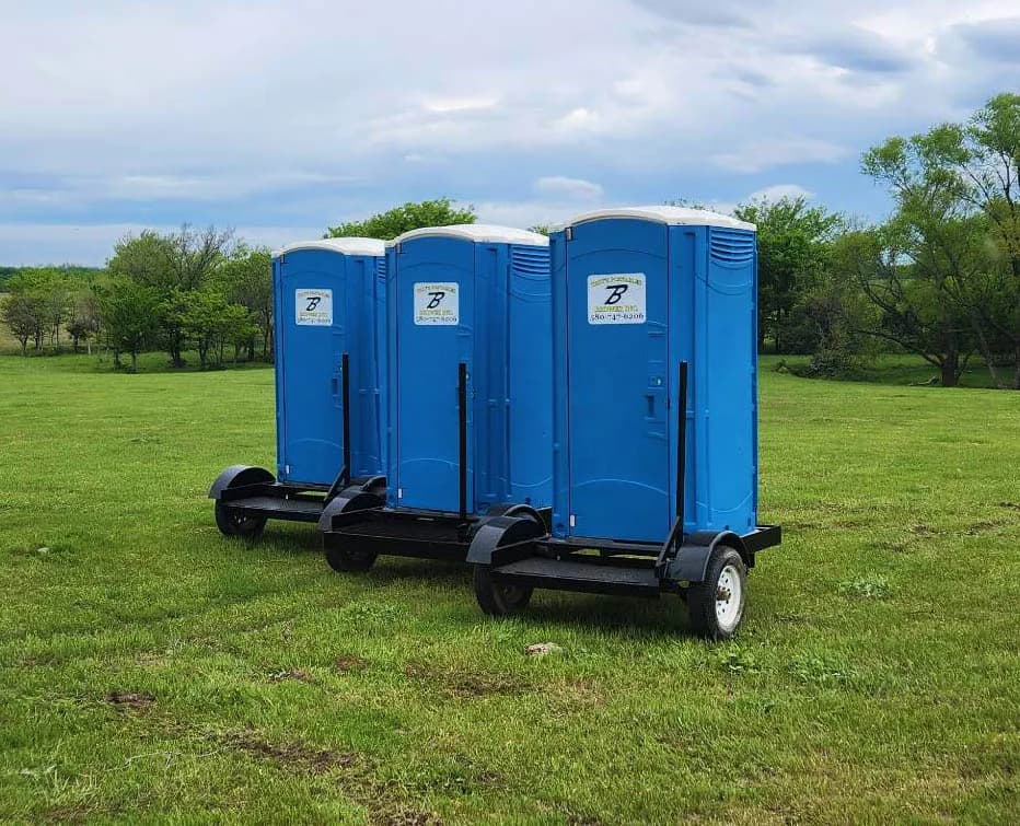 Brower Inc. ADA-compliant portable restroom trio mounted on trailer ready for delivery in Newkirk, Oklahoma