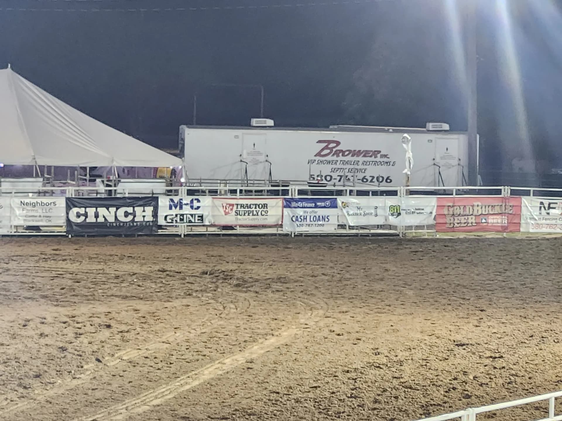 Brower Inc. VIP restroom trailer set up behind a rodeo arena